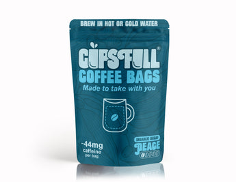 Blue package of 'Guts Full Coffee Bags' on a white background