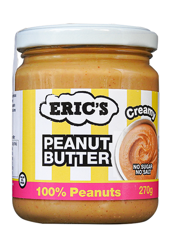 A 270g glass jar of Eric's Creamy Peanut Butter on a white background. The jar contains creamy peanut butter and features a white lid with a yellow and white striped label that has black and pink text.