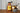 Bottle of Cravst Welsh Honey Mustard Sauce next to a bowl of ice cream with honey drizzle.