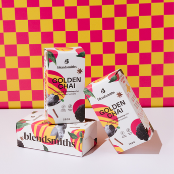 Blendsmiths Golden Chai packaging on a pink and yellow checkered background
