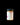 Jar of JARA honey with flowers in the background