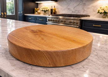 Round solid hardwood chopping board showing natural grain
