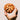 Hand holding a freshly baked cookie against a plain background