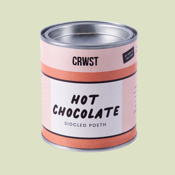 Can of hot chocolate with 'CRWST' branding on a light green background