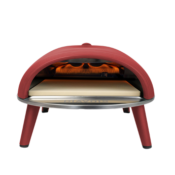 Red outdoor pizza oven with a white background