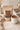 Hot chocolate package and mug on a table with a decorative card