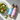 TOSS salad dressing bottles next to a fresh garden salad on marble