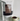 A white stand-up pouch of Bonoir Ultra Hot Chocolate with a brown label, shown next to a ceramic mug filled with hot chocolate against a plain light background.
