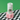 Blendsmiths bamboo whisk packaging on a checkered surface with green background
