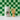 Blendsmiths bamboo whisk and container on a green checkered background