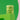 Green matcha container on a green platform with a green background