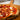 Pepperoni pizza on a wooden cutting board