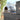 Outdoor pizza oven on a stand with a blurred background