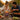 Couple cooking outdoors with Jungle Tandoori Marinade, surrounded by nature.