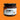 A glass jar of Chimmy's Chimichurri Smokey BBQ sauce with a black lid and a white label, set against a solid orange background.