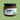 A glass jar of Chimmy's Chimichurri sauce with a black lid and a white label featuring green leaf graphics, set against a solid light green background.