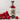 Bottle of Womersley Raspberry Vinegar with a 'Great Taste' award label, surrounded by raspberries on a light background.