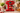 Red illy X1 Anniversary espresso machine in a kitchen breakfast setting