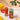 Can of Rishi Hibiscus drink with a glass of the drink on a table with mangoes and crackers.