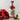 Bottle of Womersley Strawberry & Mint Vinegar with strawberries and mint leaves on a light background