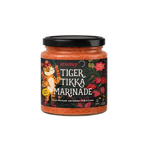 Jar of Tiger Tikka Marinade with a colorful label on a white background