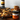 Jar of Pembrokeshire Sea Salted Caramel on a wooden table with pancakes and blueberries in the background.
