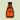 Brown bottle of Welsh sea salted caramel sauce with orange label on a beige background