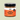 Jar of Welsh Sea Salted Caramel with a visible label on a light green background