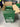 Open cardboard box with green coffee bags labeled 'Cups Full' on a metallic surface.