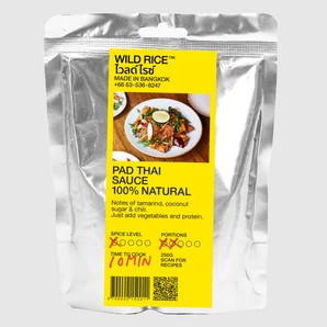 Packaged pad thai sauce with a yellow label on a white background