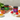 Assorted jars of food products on a white surface with a neutral background