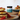 Jar of BARTI RUM SALTED CARAMEL on a table with pancakes and berries in the background