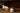 Jar of salted caramel sauce on a wooden surface with a blurred background